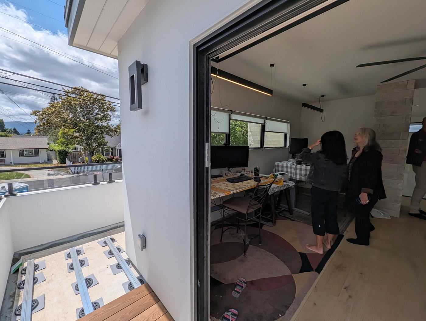 Guests on the upper deck looking into the loft office
